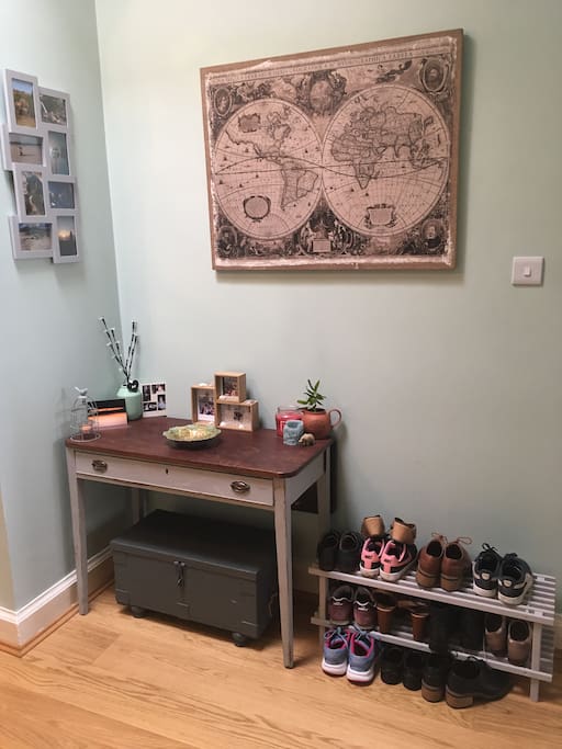The hall- shoe rack present for guests to store their shoes.
