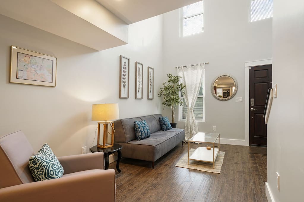 Living room w/ double height ceiling