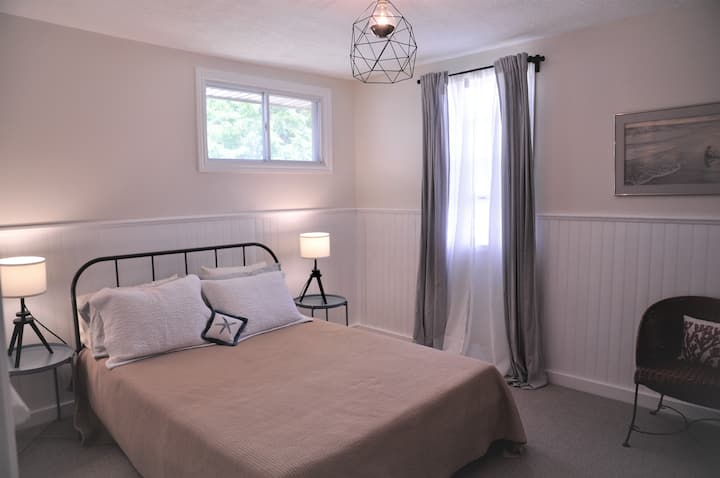 The master bedroom is spacious, light and airy - open the window to get the afternoon/evening breezes through.  A queen bed with matching side tables welcomes you for a restful sleep.
