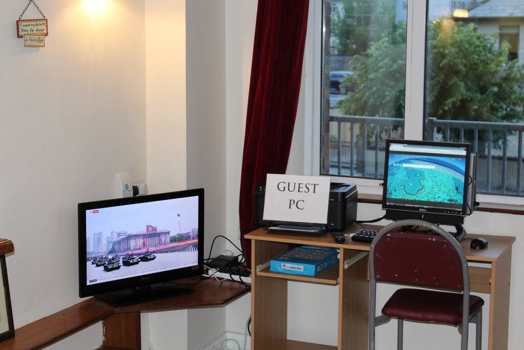 Close up of TV and Guest PC with printer/scanner