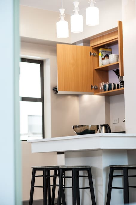 dining area and kitchen equipped with cooking and dining utensils