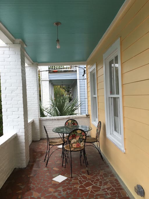 Enjoy quiet nights or fun weekends outside on this lovely Charlestonian style front porch!