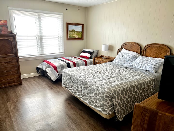 1st bedroom with beautiful matching dressers and night stand. Bonus: lamp with a USB port.