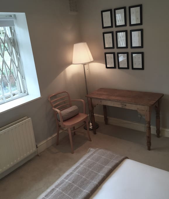 Light workspace with room for personal belongings.