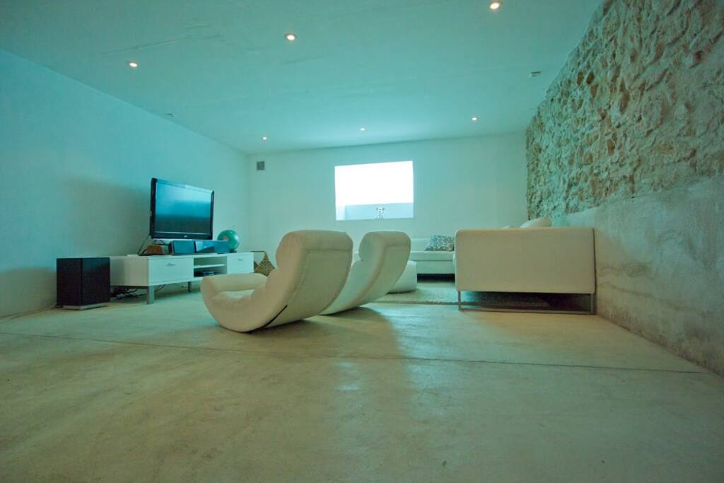 TV area with window into pool