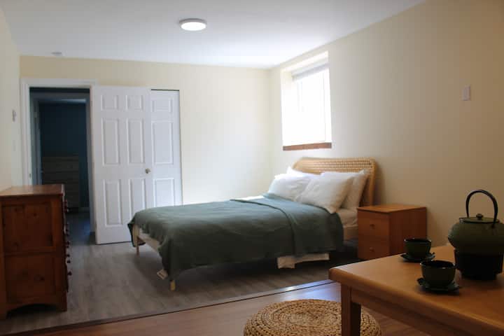The Queen bed in bedroom 1