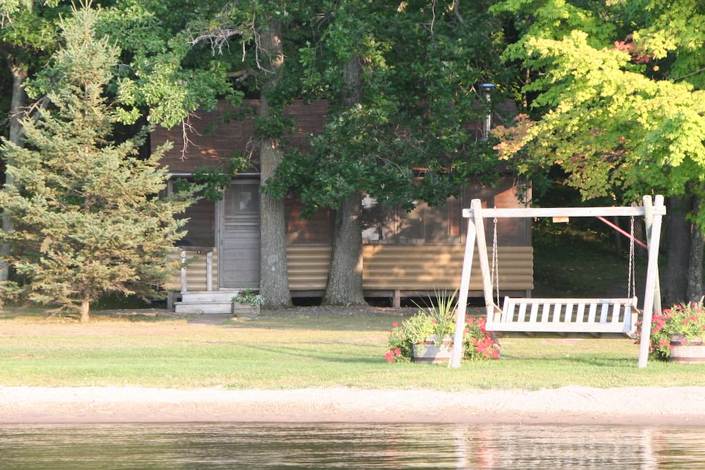 Lakeside swing is perfect place to enjoy a good book or watch the kids play.