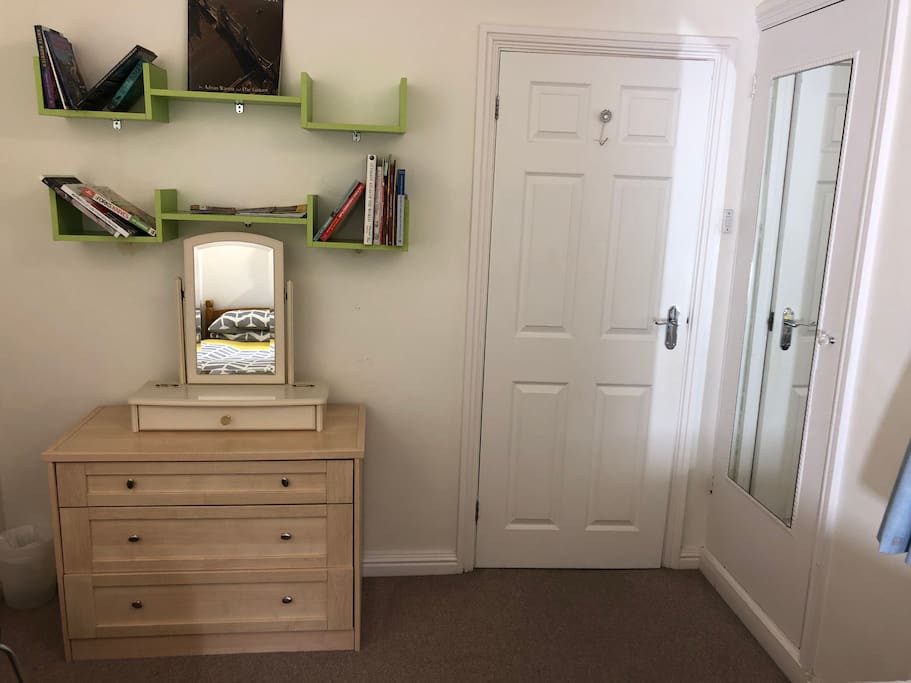 Double bedroom: twin single beds
Lime green book case
