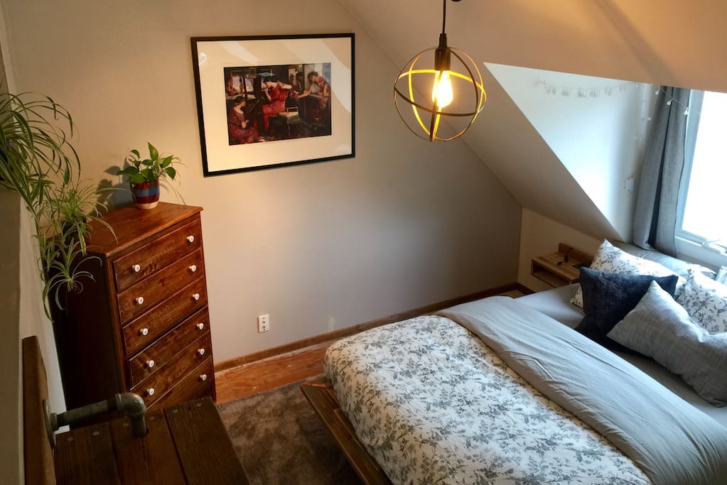 Cozy sleeping area #1 with queen size bed. All natural premium mattress.