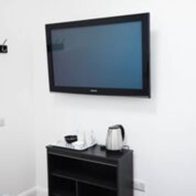 TV, kettle, cups, tea coffee milk