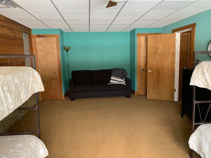 Lake House - Lower level bedroom with queen pullout couch and two sets of twin bunk beds