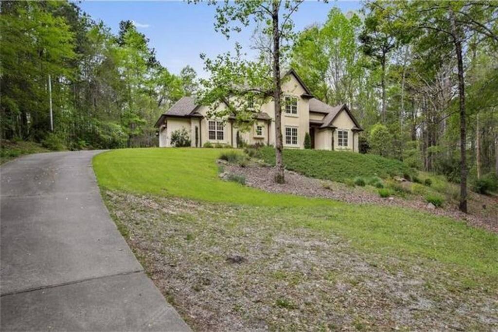 Long winding driveway from electronic entry gate