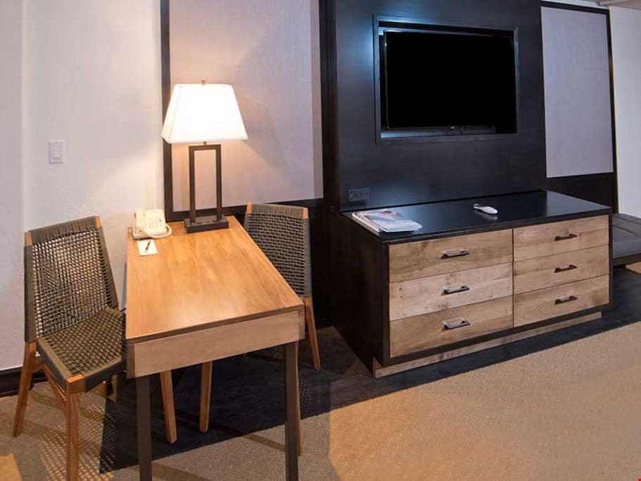 Sit back and watch a movie on the flat-screen TV, or get some work done at the table.