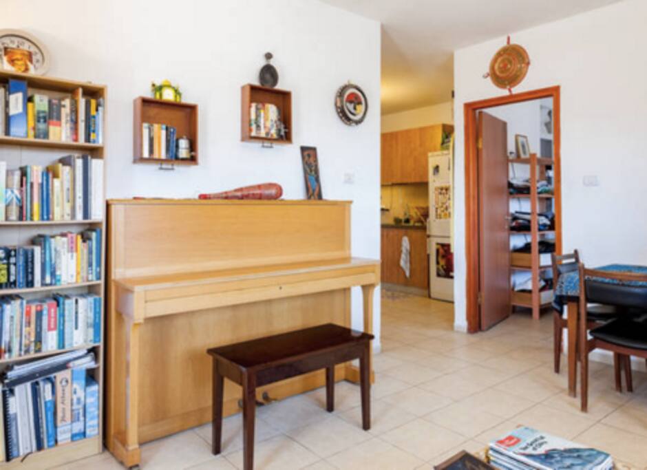 Piano and sunlit livingroom