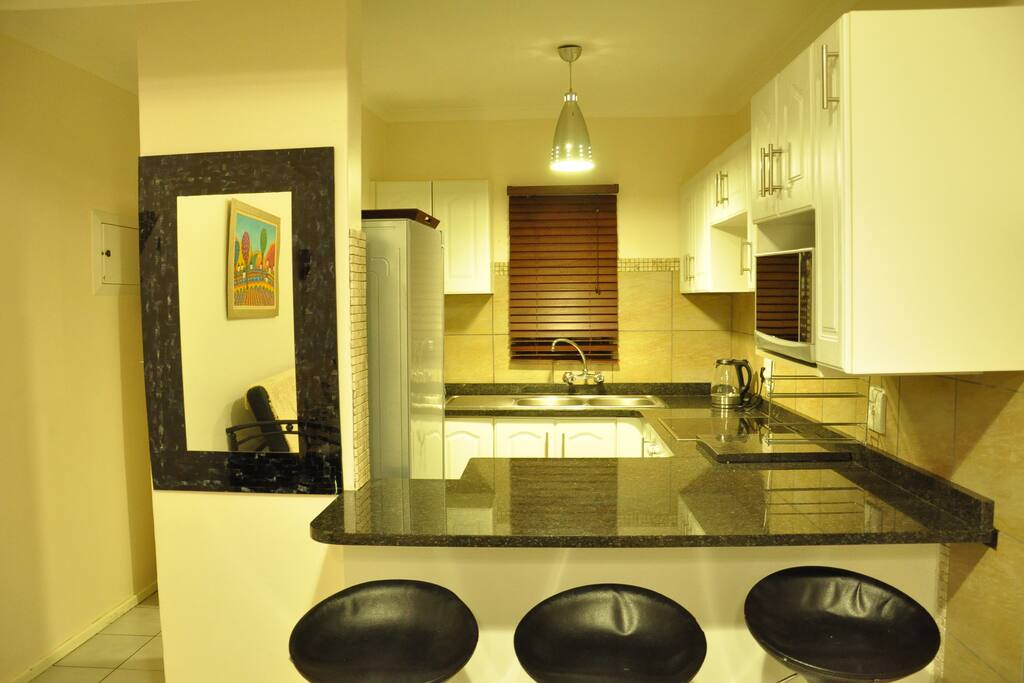 Fully fitted kitchen with ceramic top heat plates