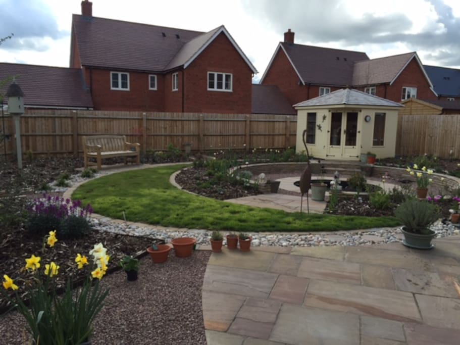 Sunny South facing garden with pond and summer house