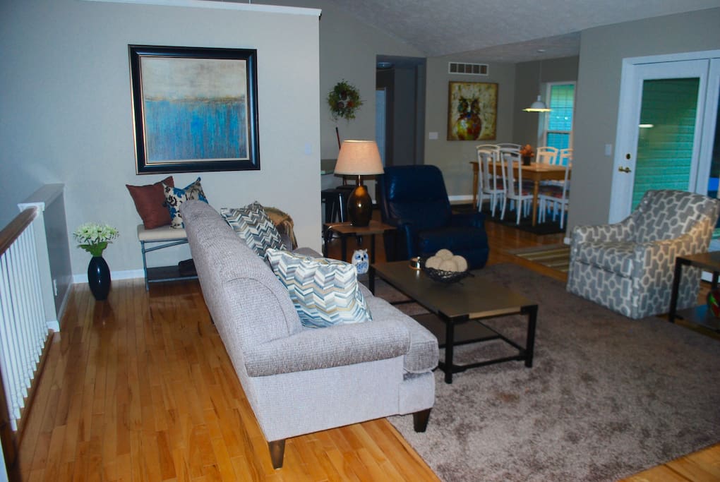 Large open living area with vaulted ceilings, access to deck and gas log fireplace. Great views!