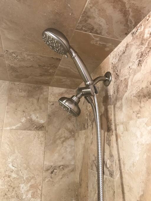 Spa shower head back bathroom.