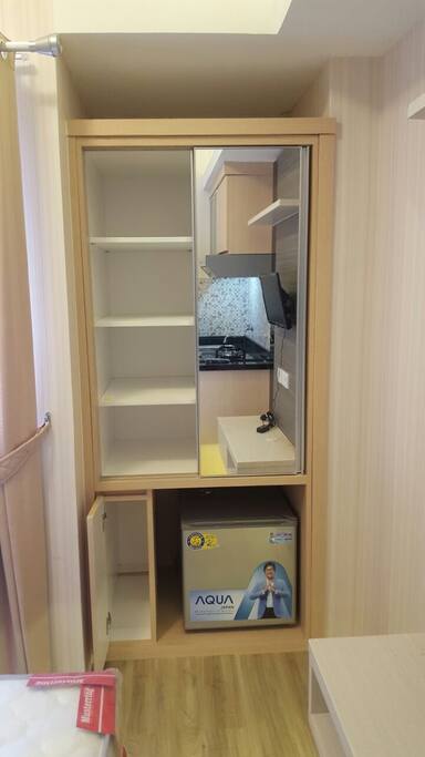 Cupboard, mirror and refrigerator