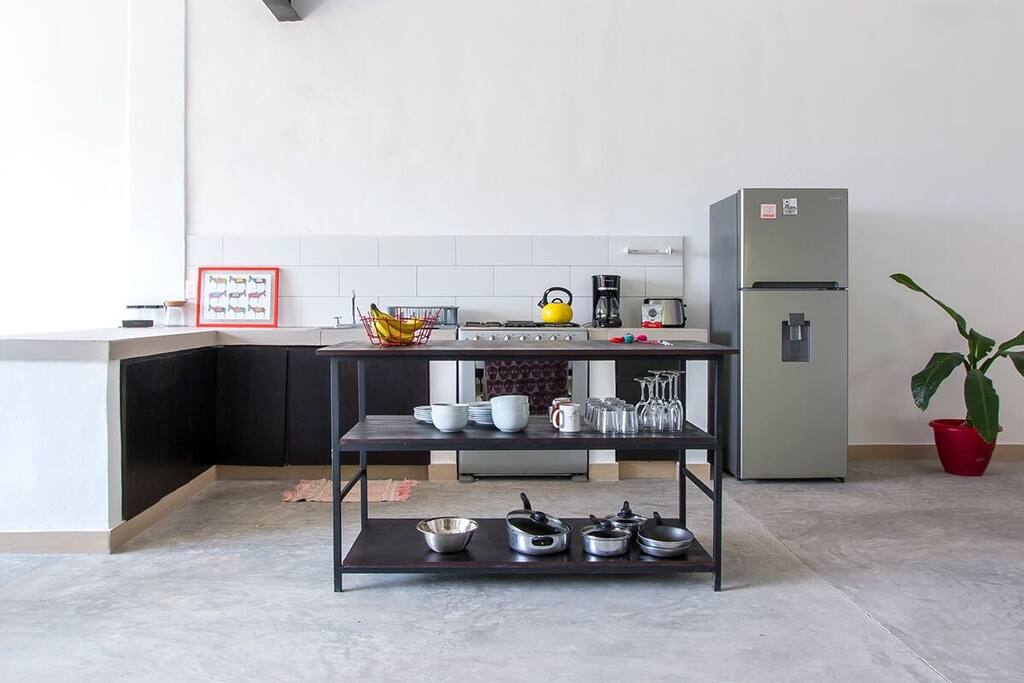 Open kitchen with brand new appliances.