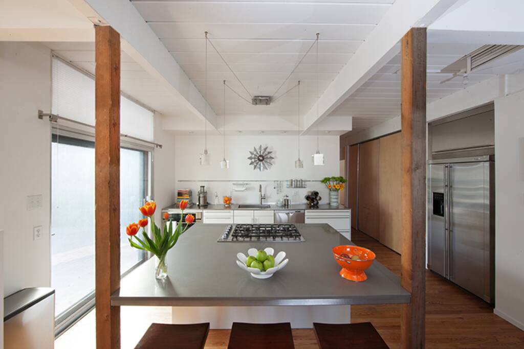 Kitchen - Five-burner gas stove for gourmet creations. Three steps to the patio.