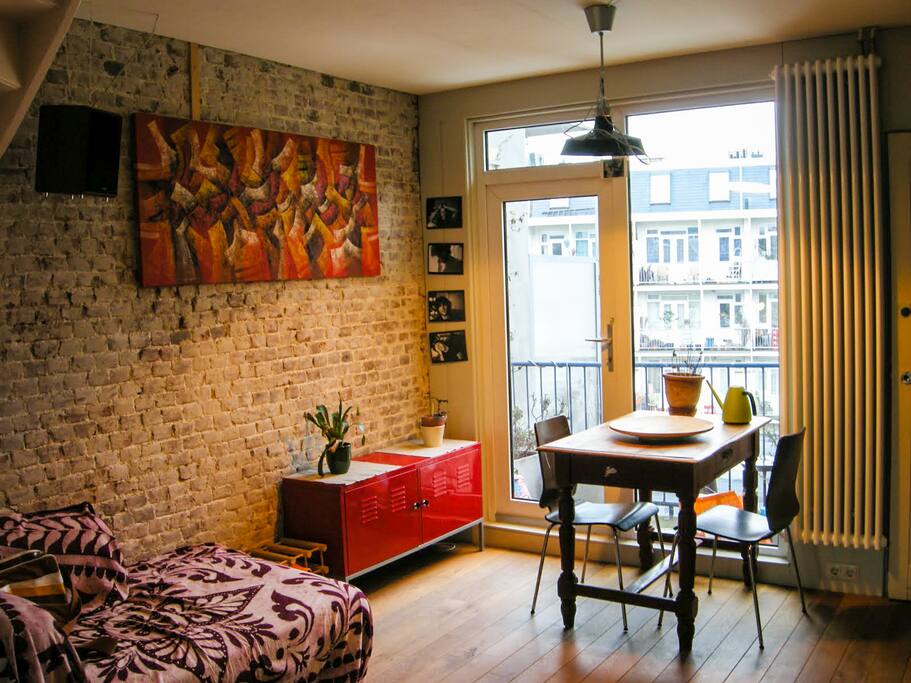 Big kitchen with table and sofa