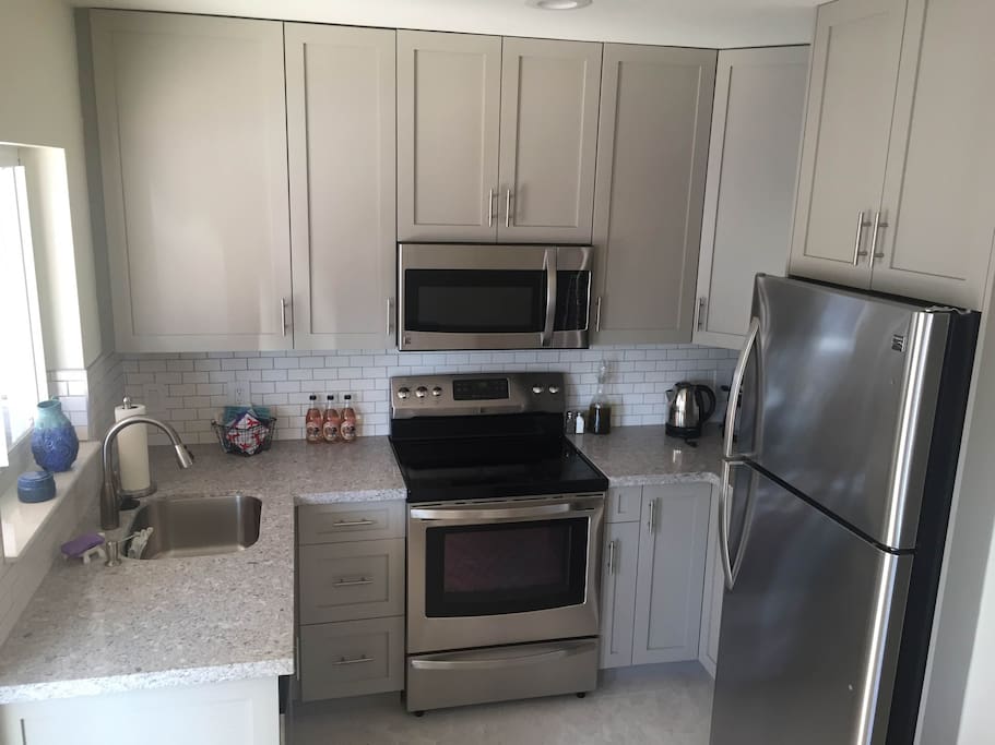 Quartz Countertops, Quality Cabinets, Natural Light. We have all the cooking supplies and coffee maker. Stop at the nearby Publix, Whole Foods or Trader Joe's for groceries and paper products.
