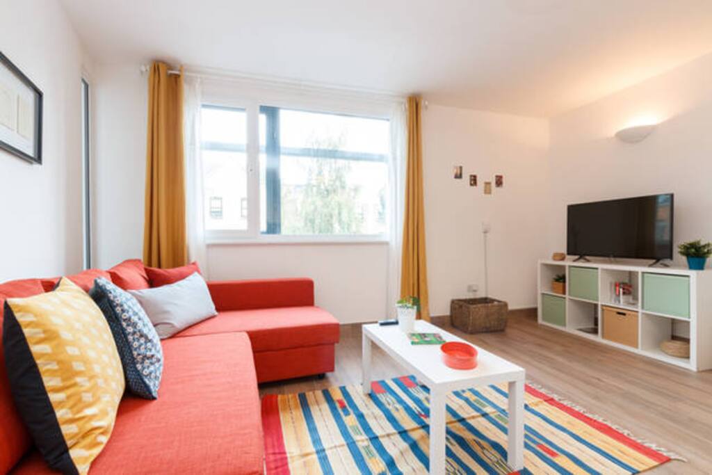 Relaxing area with large, comfy sofa bed and 43-Inch Smart TV