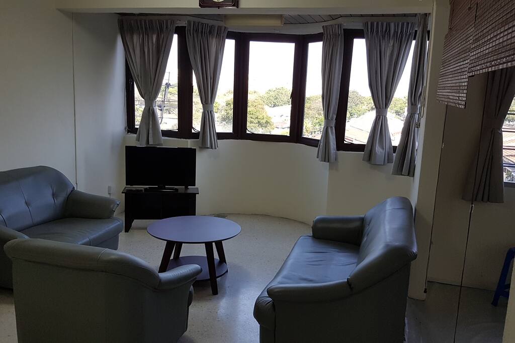 Spacious lounge of the bright corner 880sqf apartment.