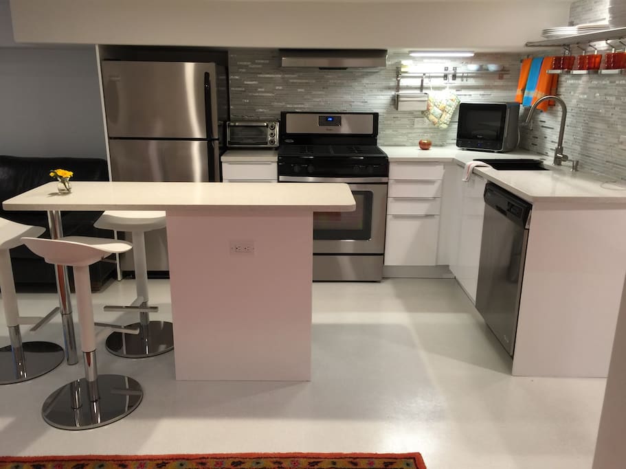 Full kitchen with dishwasher.