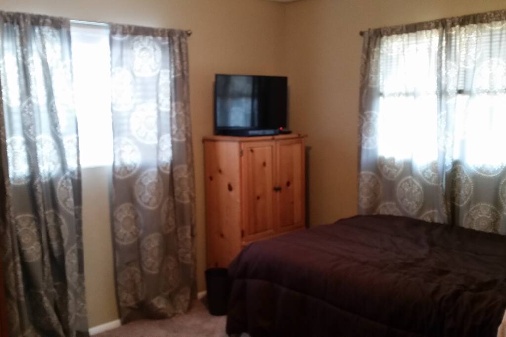 Another bedroom view with Smart TV.