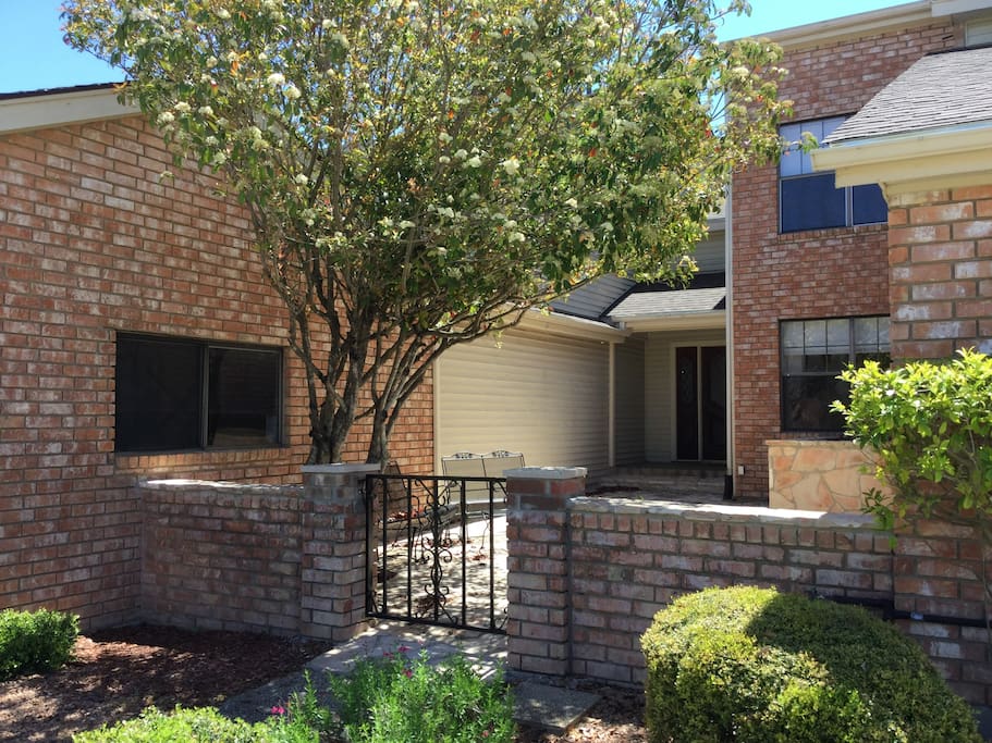 Front, enclosed flagstone patio