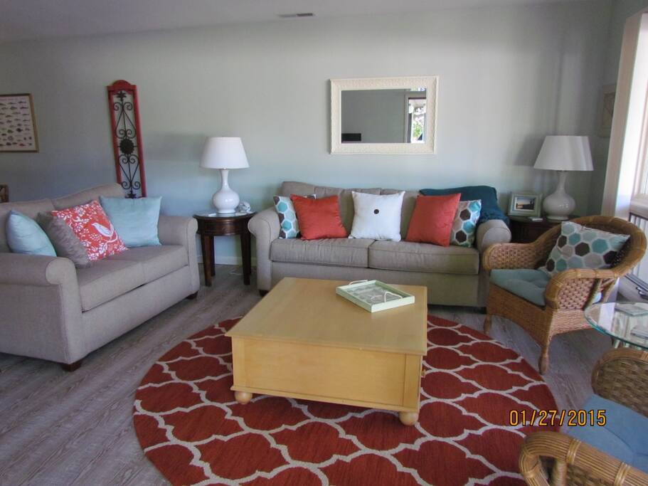 The living room has plenty of seating, a wonderful view of the lagoon and golf course, and an Smart HDTV with Blu-Ray DVD and stereo system.