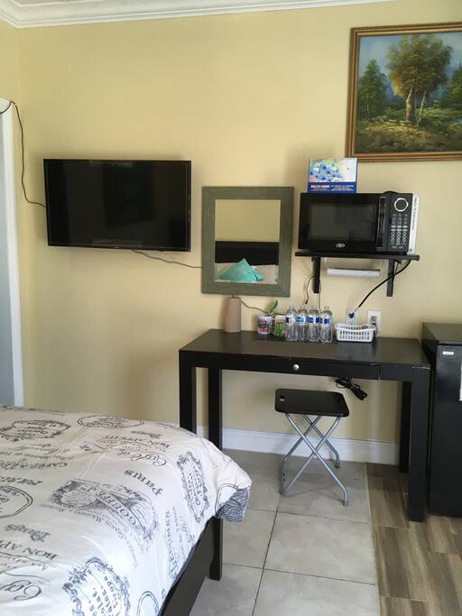 Tv, microwave, desk, mini fridge