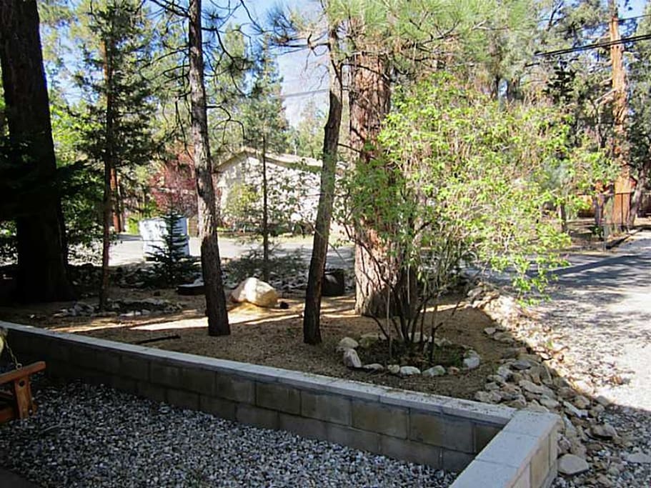 This view is looking from the front door of the cabin into the streets. You'll have a wonderful landscaped front yard to greet you when you arrive.