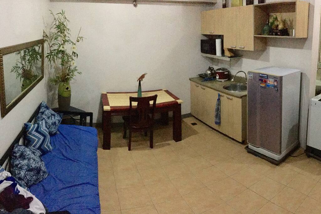 Spacious living and dining area of a 1BR condo unit in Cubao near Camp Crame, Santolan, Boni Serrano