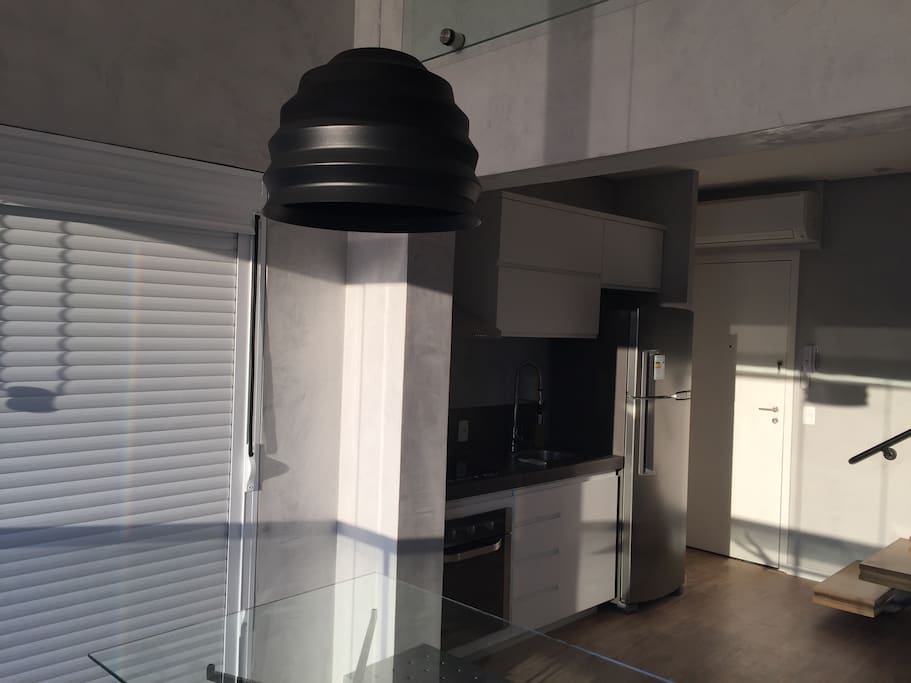 View from dinning room to kitchen and main entrance