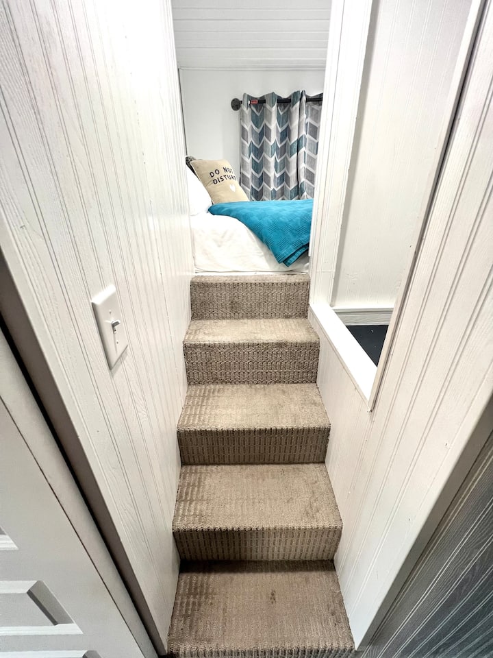 Stairs to upper sleeping area.