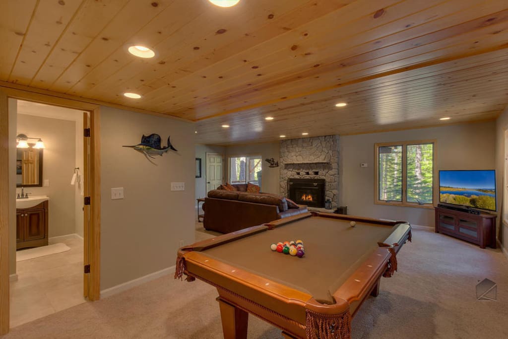Turn on the game and play a round or two of pool downstairs.