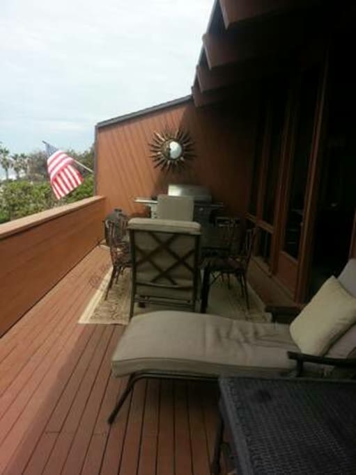 Large Private furnished deck with stainless bbq, lounge chairs,umbrella,table and chairs.