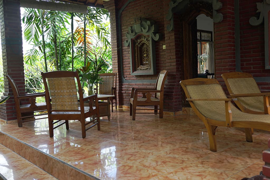 Downstairs terrace with pond and garden view