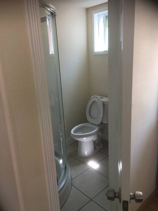 Bathroom full size Toilet also standing bath with sink