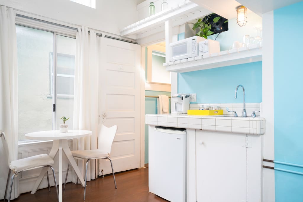 High ceilings, kitchenette, seating area.