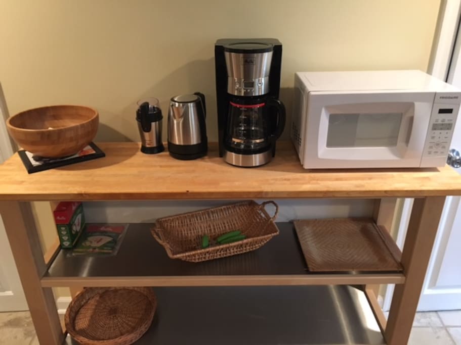 Prep-counter with coffee-maker, coffee grinder, micro-wave & electric kettle.