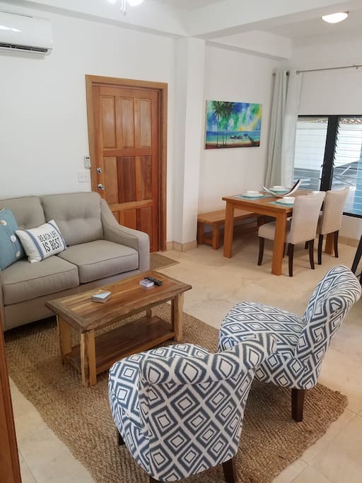Enjoy your stay with a bright cheerful open floor plan with new comfortable furnishings and custom Belizian hardwood furniture....