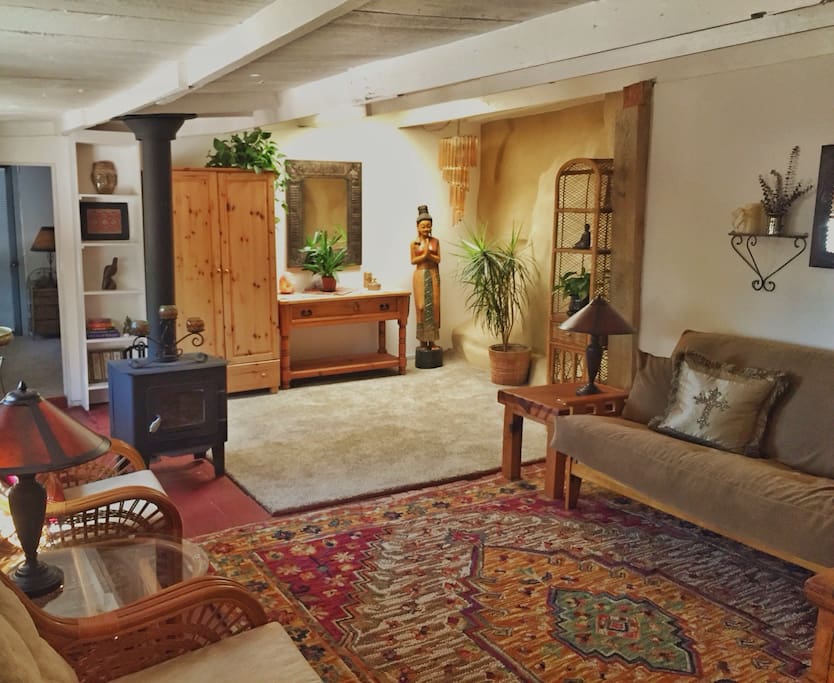 The yummy living room of the Coop! Yes that is a rock wall to the right of the statue in the right middle of the picture.