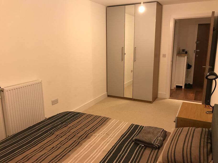 The available bedroom. Spacious with wardrobe, comfortable bed, bedside table and fan. Again with its own balcony on the 16 floor