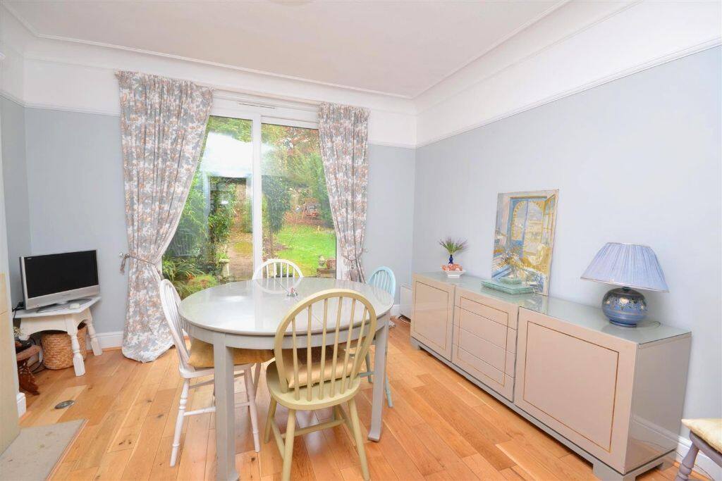 Dining room; views of patio and garden.