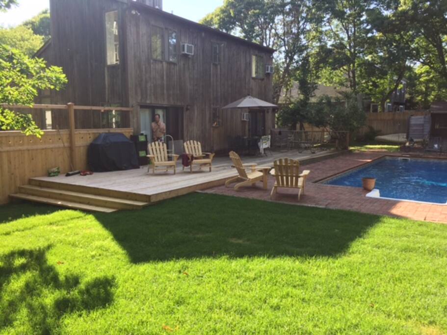 Expanded deck and grass area for playing games
