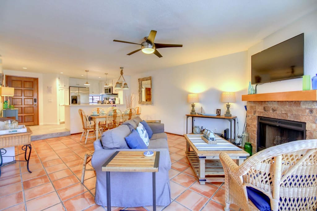 The sun-flooded, airy, open floor plan at Driftwood flows smoothly from the front entrance and kitchen into the dining and living rooms